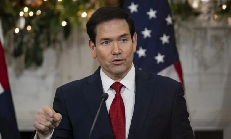 Marco Rubio speaks with American flag backdrop.