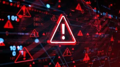 Red warning signs and digital data on a dark background, indicating a cyber threat.
