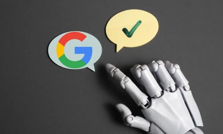 Robot hand points to Google logo and checkmark speech bubbles on gray surface.