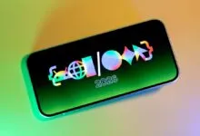 Smartphone displaying a colorful logo and the year 2026 on its screen.