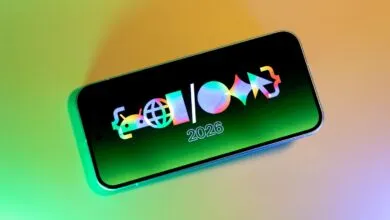 Smartphone displaying a colorful logo and the year 2026 on its screen.