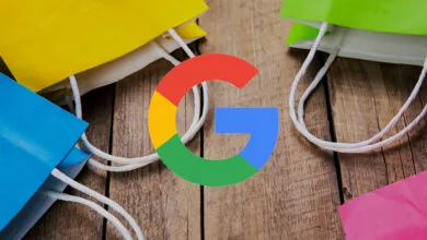 Google logo on wood with colorful shopping bags around it.