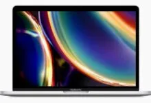 Silver MacBook Pro laptop with a colorful abstract display.