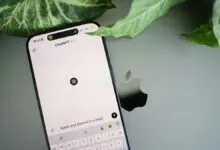 iPhone displaying ChatGPT 4 interface on Apple laptop with green leaf.