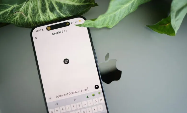 iPhone displaying ChatGPT 4 interface on Apple laptop with green leaf.