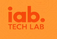 IAB Tech Lab logo in orange against a circuit board background.