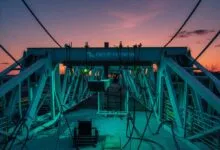 Deep Fission structure with complex framework against a sunset sky.