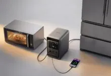 Anker power station powering microwave, fridge, and charging a smartphone.