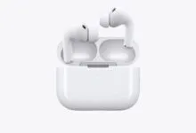 Close-up of white AirPods Pro in open charging case on white background.