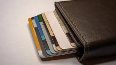 Brown leather wallet filled with various credit and debit cards.