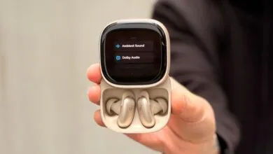 Open earbuds case displaying 'Ambient Sound' and 'Dolby Audio' options.