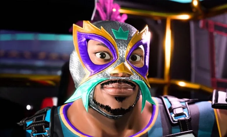Close-up of a wrestler wearing a colorful, ornate lucha libre mask.