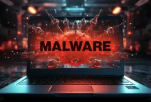 Laptop screen displays a red malware virus with the word 'MALWARE' in bold letters.
