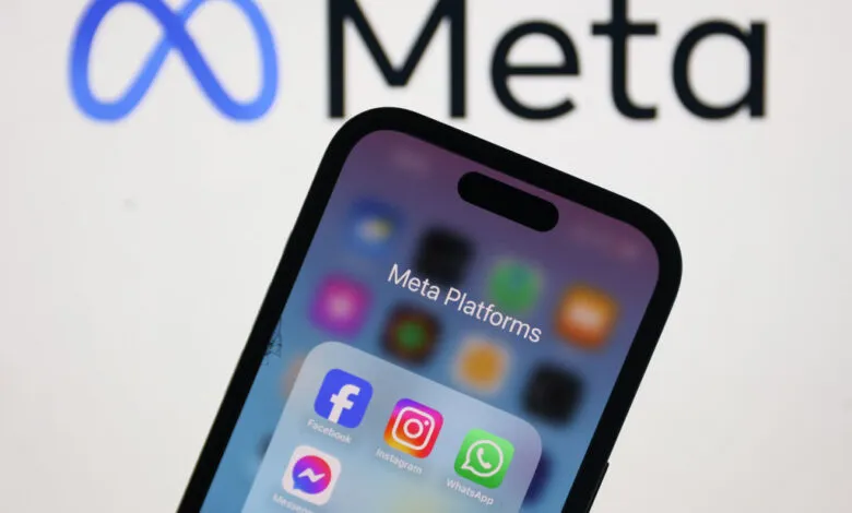 Meta Platforms apps displayed on a smartphone with the Meta logo in the background.