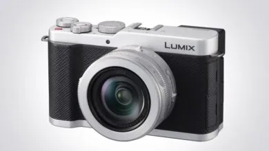 Silver and black Panasonic Lumix camera with Leica lens.