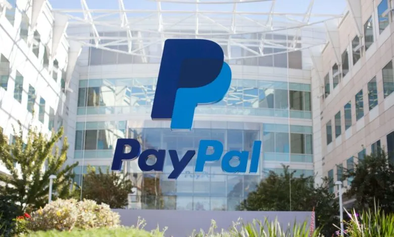 PayPal logo in front of corporate headquarters building.