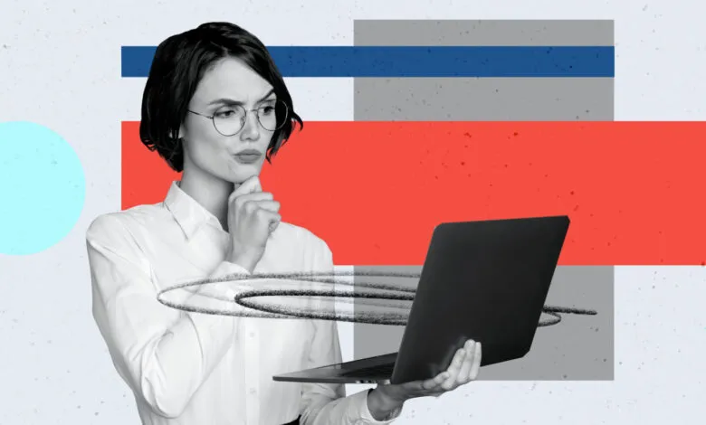 Woman in glasses thoughtfully holding laptop against abstract background.