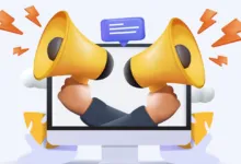 Two hands holding megaphones emerge from a computer screen, promoting a message.