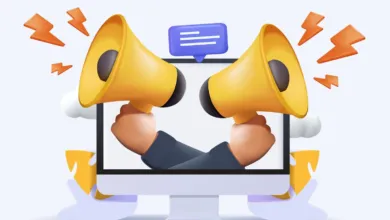 Two hands holding megaphones emerge from a computer screen, promoting a message.
