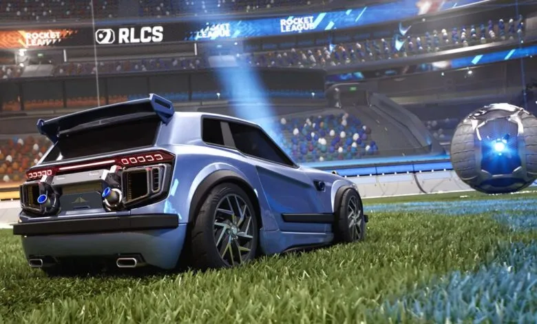 Blue car and ball on Rocket League field, stadium backdrop.