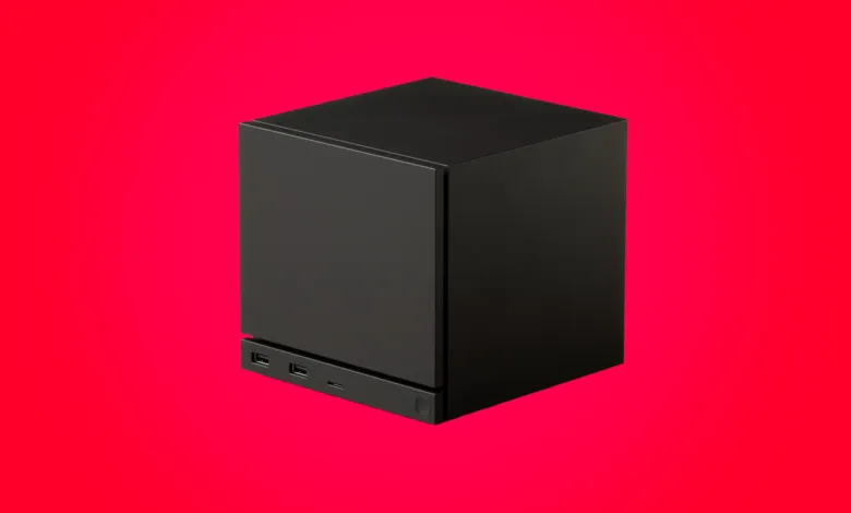 Black cube-shaped device with ports on a vibrant red background.
