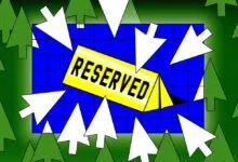 Illustration of a reserved sign in a forest with cursor arrows.