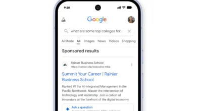 Google search results on a phone for top colleges, showing sponsored ads.