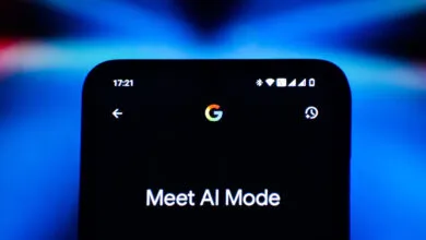 Close-up of a smartphone screen displaying 'Meet AI Mode' with Google logo.