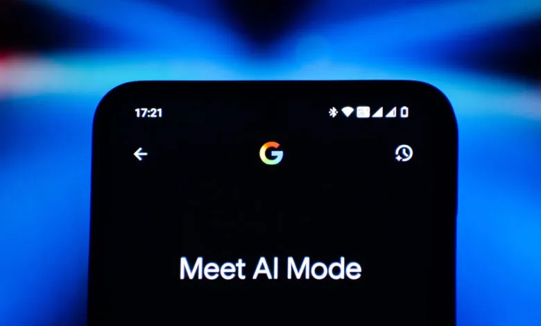 Close-up of a smartphone screen displaying 'Meet AI Mode' with Google logo.