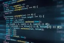 Close-up of computer code on a dark screen with colorful syntax highlighting.
