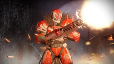 Red and white armored figure holding a large gun in a war-torn environment.