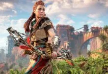 Aloy from Horizon Forbidden West stands ready with her bow in a lush, vibrant landscape.