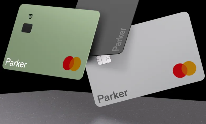 Three Parker Mastercard credit cards in green, gray, and silver.