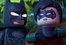 Lego Batman and Robin stand side-by-side, looking serious.