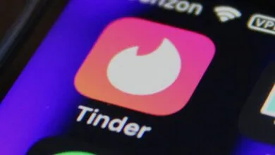 Close-up of the Tinder app icon on a smartphone screen.