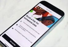 Uber app showing 'Book a trip for someone else' feature on a smartphone.