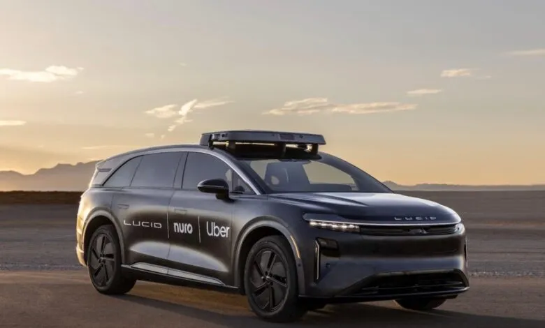 Lucid Air autonomous vehicle with Uber and Nuro logos on the side.