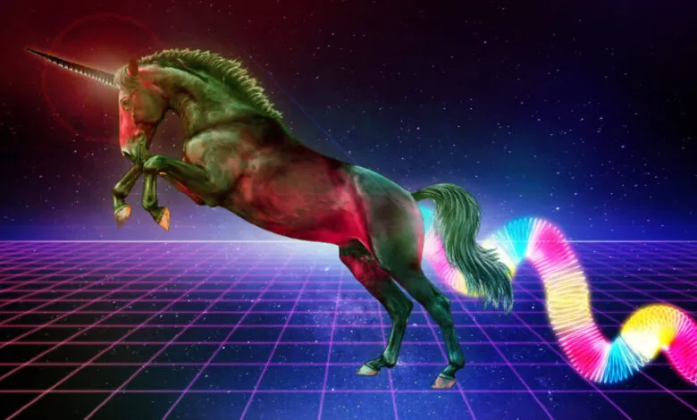 A rearing unicorn with a rainbow slinky tail on a grid background.
