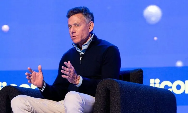 Jeff Shell, NBCUniversal CEO, speaks at a conference, gesturing with his hands.