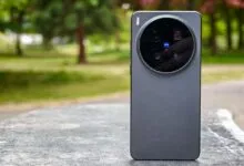 Vivo X300 Ultra smartphone with circular camera module on a stone surface.