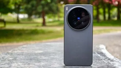 Vivo X300 Ultra smartphone with circular camera module on a stone surface.