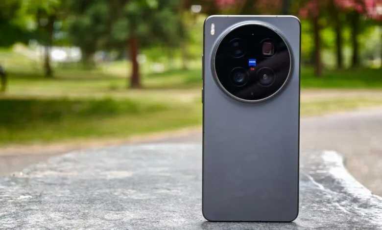 Vivo X300 Ultra smartphone with circular camera module on a stone surface.