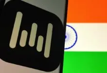 Wispr logo on phone screen with Indian flag background.