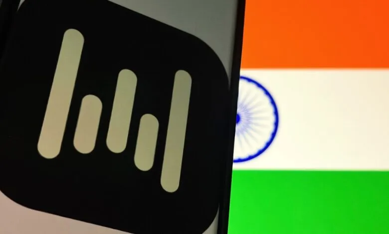 Wispr logo on phone screen with Indian flag background.