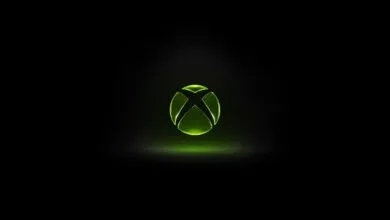 Glowing green Xbox logo on a black background.