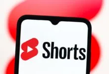 Close-up of a smartphone displaying the YouTube Shorts logo.