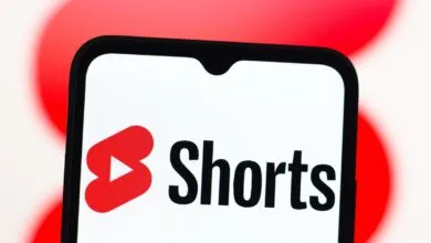 Close-up of a smartphone displaying the YouTube Shorts logo.