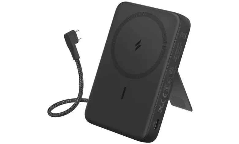 Black portable wireless charger with stand and charging cable.