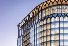 Revolut office building exterior with glass windows and modern architecture.