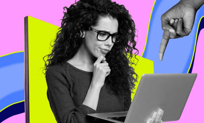 Woman with glasses looks thoughtfully at laptop as a hand points at the screen.
